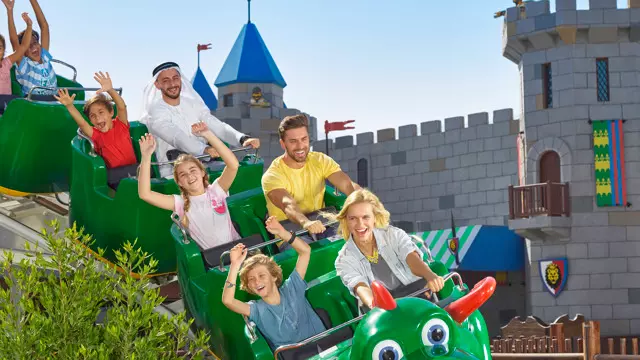 A family on The Dragon roller coaster at LEGOLAND Dubai
